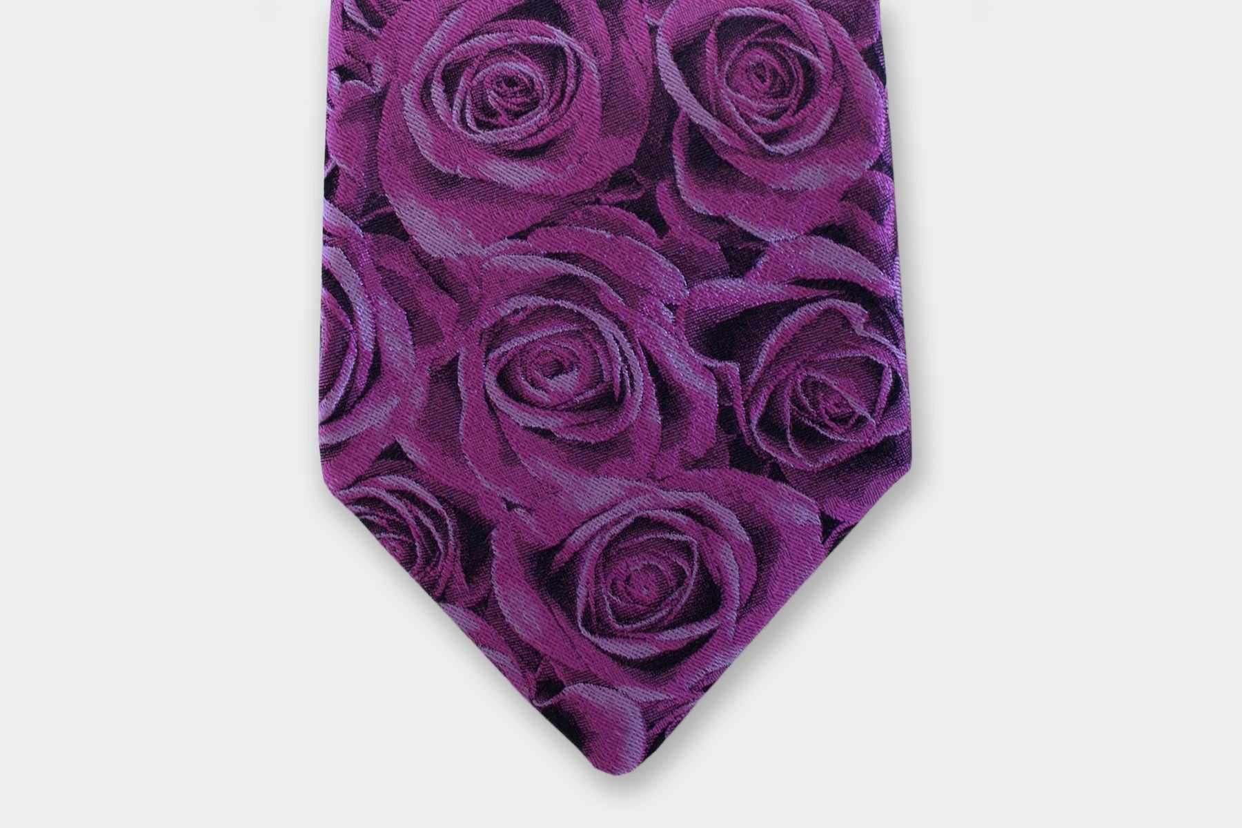 Close-up of a Robert Charles rose purple silk tie highlighting the fine Italian craftsmanship and intricate weave.