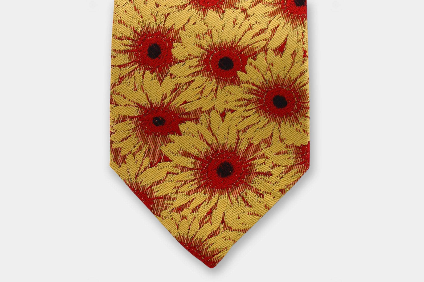 Close-up of a Robert Charles gerbera yellow silk tie showcasing the artisan Italian intricate weave.